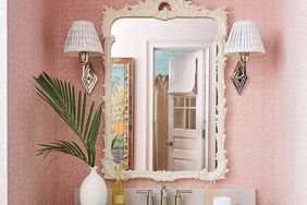 Pink bathroom with sconces