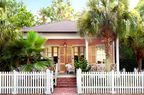 Pink Cottage Among Palm Trees in Pass Christian, MS