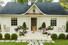 White House with potted pink and purple hydrangeas