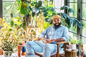 Hilton Carter at home in Baltimore, MD with his houseplants