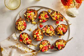 Southern Living Grilled Baby Eggplants With Tomato-Corn Relish on a platter to serve