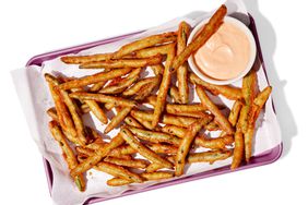 Southern Living Green Bean Fries With Spicy Dipping Sauce on a pan to serve