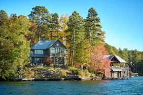 Exterior of two houses on a lake