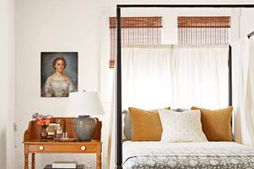 Bedroom with canopy bed and white walls