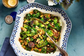 Southern Living Brussels Sprouts With Pomegranate Molasses And Walnuts in a bowl to serve