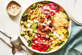 Southern Living Steak Taco Salad in a bowl to serve with extra dressing beside