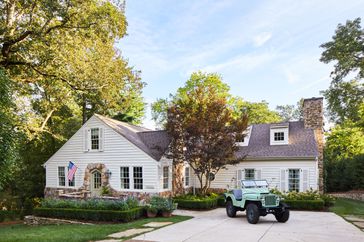 Lookout Mountain Tennessee white cottage exterior with Jeep in driveway