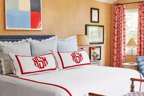 Natalie Steen bedroom with white and red monogrammed pillow shams