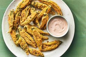 Southern Living Smashed Oven-Fried Okra on a platter to serve with dipping sauce