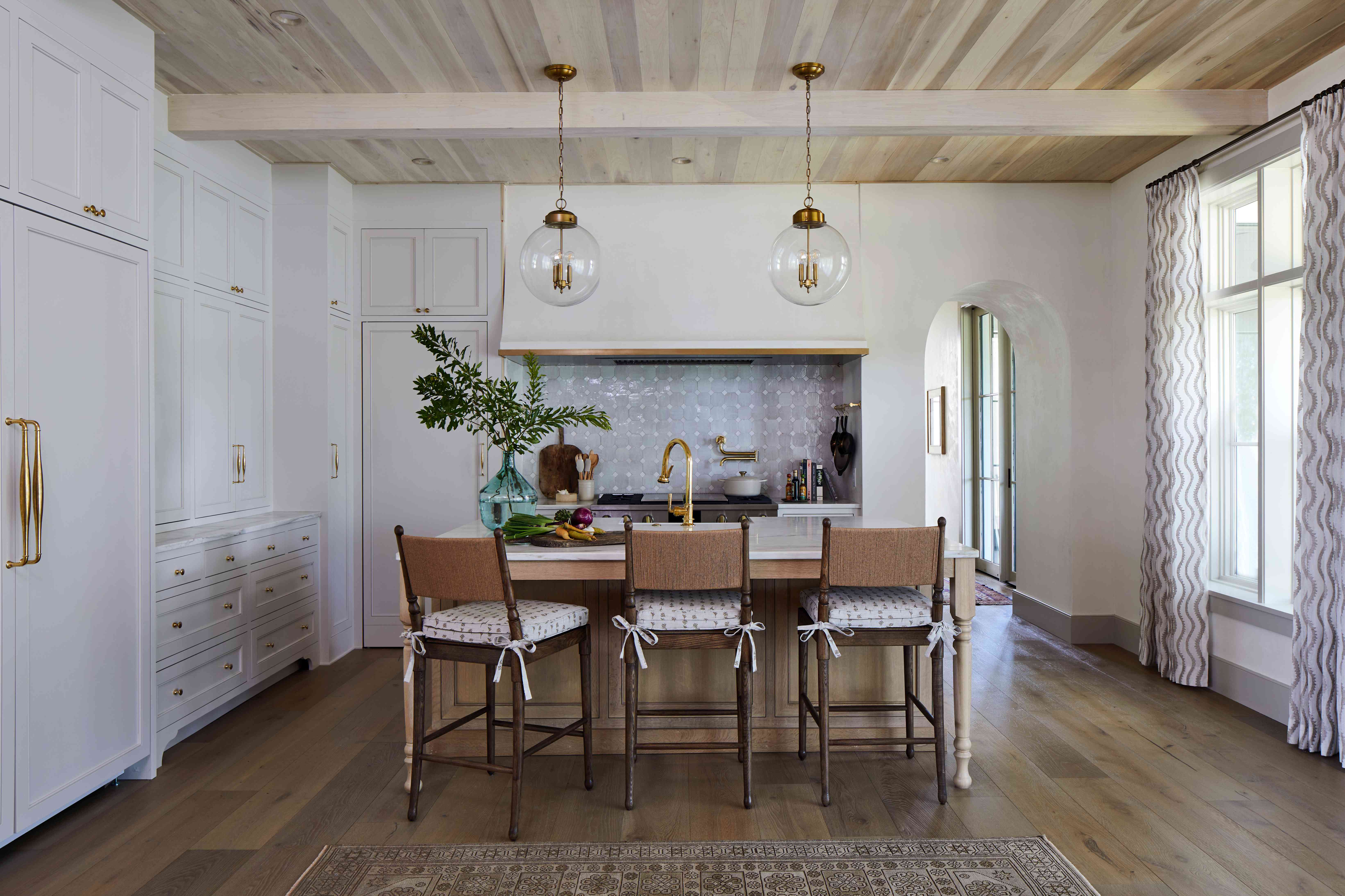 2024 Southern Living Idea House kitchen white walls three counter stools