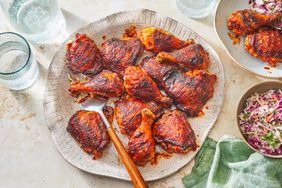 Southern Living BBQ Chicken on a platter ready to serve with coleslaw