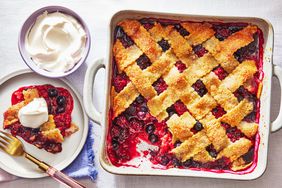 Southern Living Berry Cobbler baked and ready to serve with whipped cream