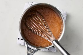 Southern Living Caramel Frosted Pound Cake whisking in the caramelized sugar