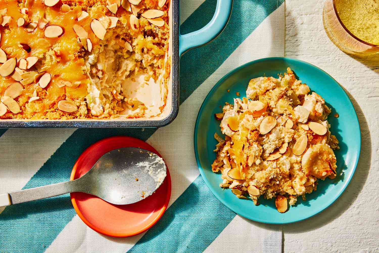 Southern Living Chicken and Wild Rice Casserole with a serving scooped out onto a teal plate