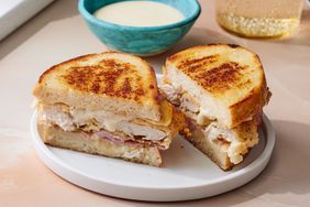 Southern Living Chicken Cordon Bleu Sandwich sliced on a plate to serve