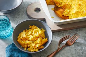 Southern Living Cornbread Casserole with a serving scooped out into a bowl