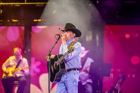 George Strait Singing Into Mic