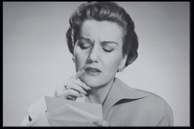 Woman reading letter vintage photo