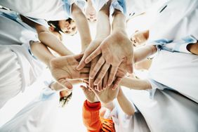 group huddle, hands