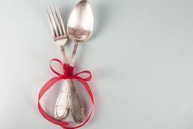 Sterling Silver Spoon And Fork Tied With A Ribbon