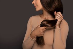 Brunette girl with long straight and shiny hair