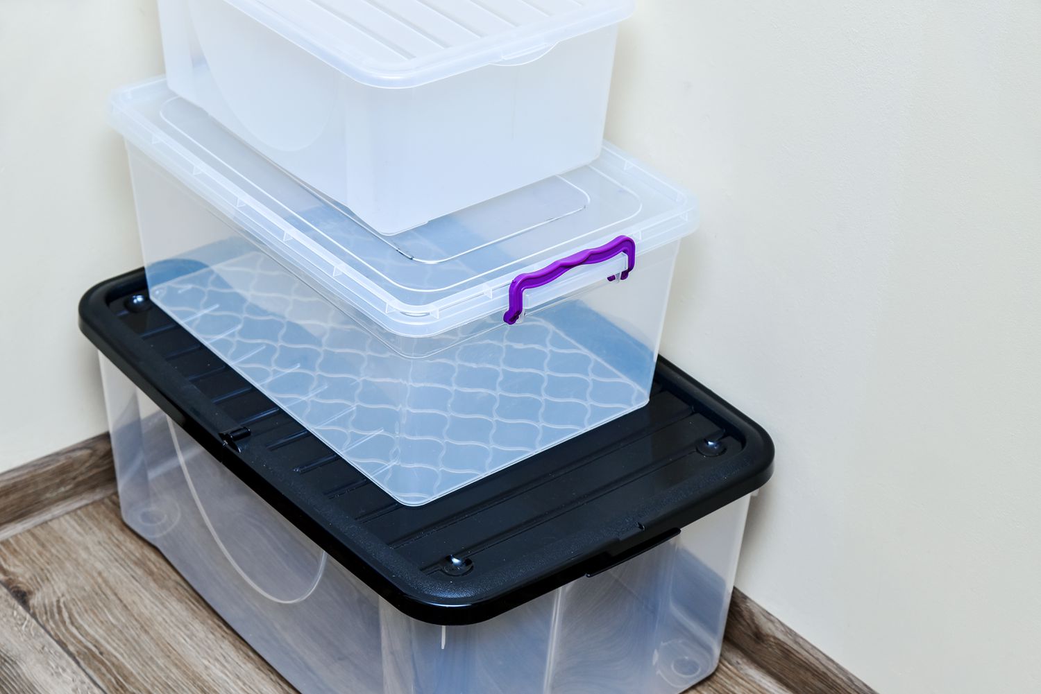 Empty plastic storage boxes in stack. 