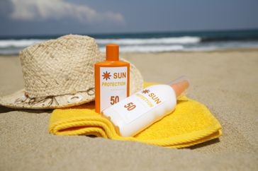 Bottles of sunscreen on the beach