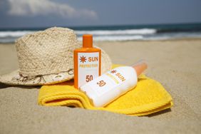 Bottles of sunscreen on the beach