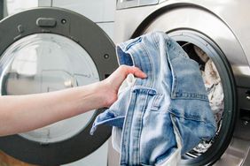 Putting denim clothing into a washing machine