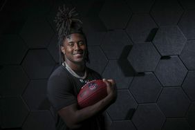 Cornerback Kool-Aid McKinstry poses with football at the Indiana Convention Center 