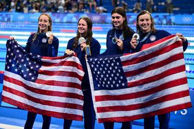 silver medallists Team USA US' Claire Weinstein, US' Paige Madden US' Katie Ledecky and US' Erin Gemmell pose on the podium of the women's 4x200m freestyle relay swimming event during the Paris 2024 Olympic Games