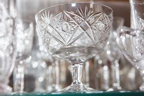 crystal glasses arranged on shelves