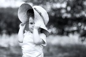 Little girl wearing sun hat