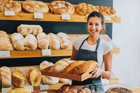 Female Baker Tray of Bread