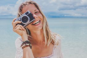 Girl a the Beach with Camera