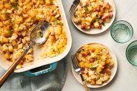 Southern Living Ham and Potato Casserole scooped out onto plates to serve