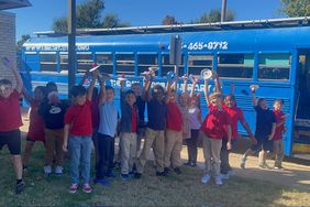 Students celebrate the Seas the Day Mobile Library.