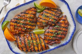 Key West Chicken on a platter with lime and orange