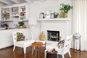 Brick fireplace painted white to match the walls