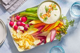 Southern Living Dill Dip in a bowl to serve with a platter of vegetables and potato chips