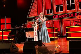 Sarah Hardwig Stands At Mic On Opry Stage