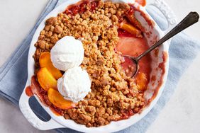 Southern Living Peach Crumble ready to serve with ice cream on top