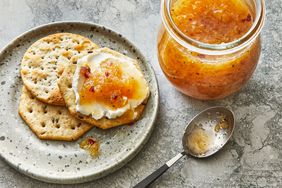 Southern Living Jezebel Sauce with some cream cheese and crackers on a plate