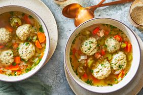 Matzo Ball Soup in individual bowls with spoons beside