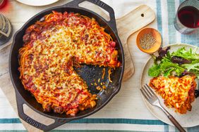 Southern Living Spaghetti Pie in the cast iron skillet with a wedge cut out to serve