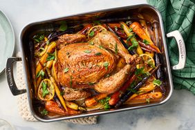 Southern Living Lemon Roast Chicken With Rainbow Carrots in roasting pan