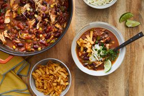 Tortilla Soup served with sliced chips and cheese