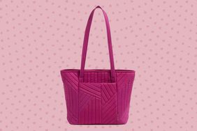 The Vera Bradley Small Vera Tote Bag on a pink dotted background